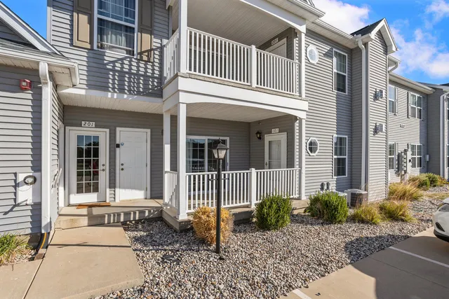 a view of a house with a small garden