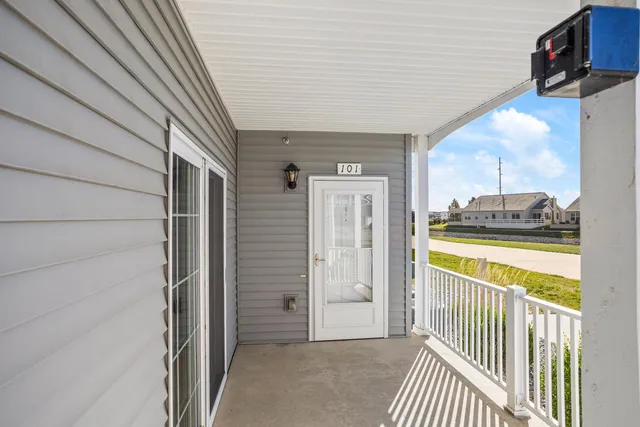 a view of a porch with a table and chair