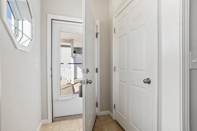a view of a bathroom from a hallway