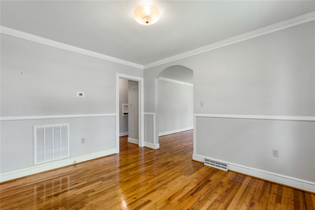 1509 869 Anderson, SC 29621 - Photo 11 of 45 Rich wood flooring stretches across this well-proportioned living space.