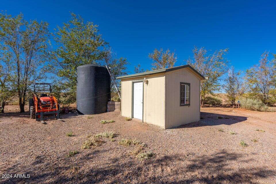 44246 Ranch Land Road Leuppx, AZ 86035 - Photo 32 of 42 Pump house and Cistern