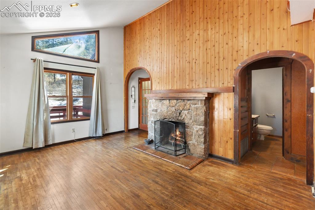 9735 Mountain Road Cascade, CO 80809 - Photo 17 of 44 a view of an empty room with window and fire place