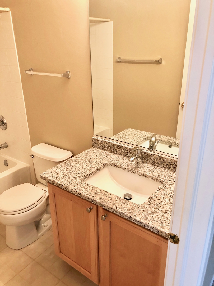 3072 Falling Waters Lane Lindenhurst, IL 60046 - Photo 11 of 27 a bathroom with a granite countertop sink toilet and shower