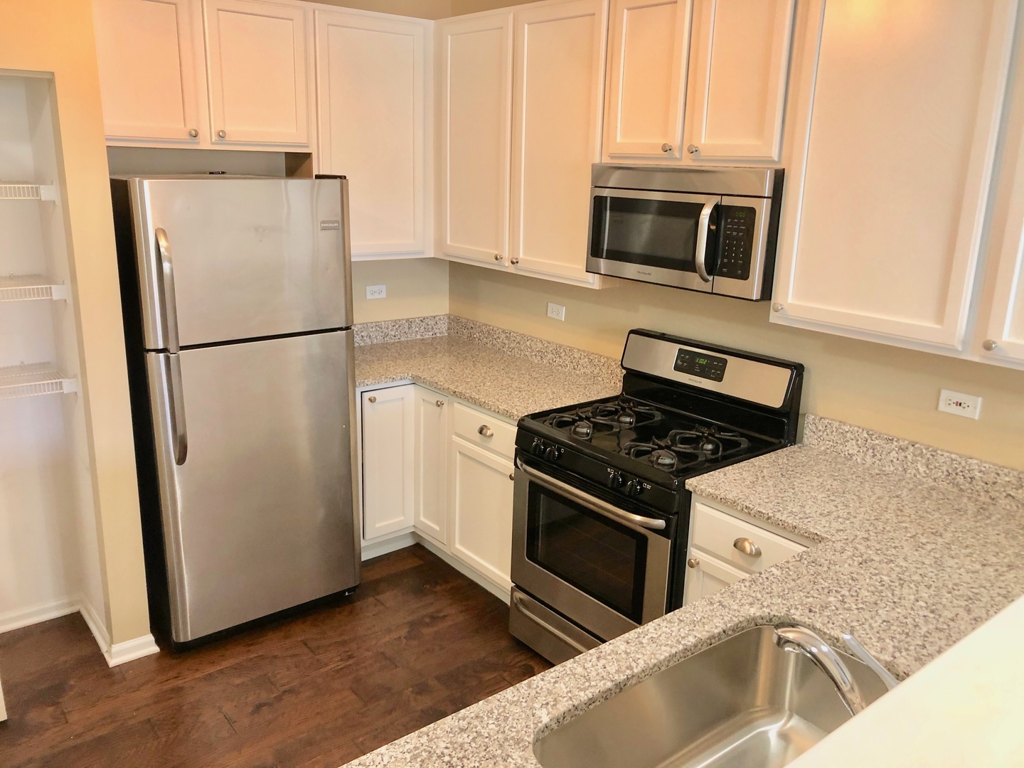 3072 Falling Waters Lane Lindenhurst, IL 60046 - Photo 2 of 27 a kitchen with stainless steel appliances granite countertop a refrigerator stove and microwave