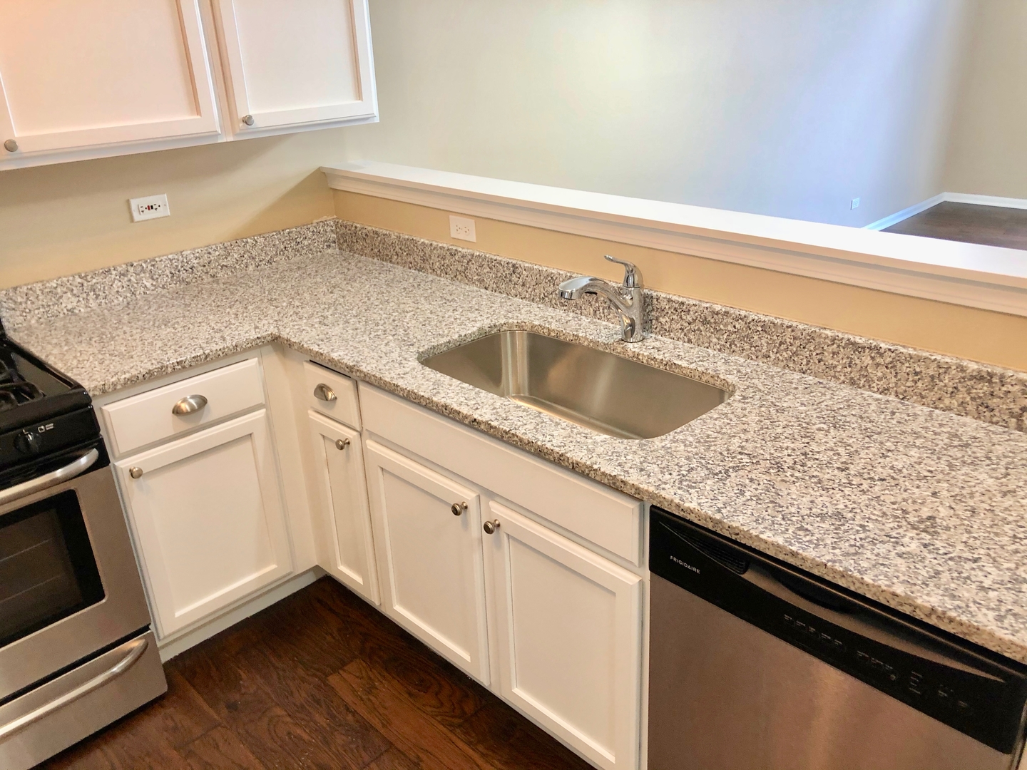 3072 Falling Waters Lane Lindenhurst, IL 60046 - Photo 3 of 27 a kitchen with granite countertop white cabinets and a sink