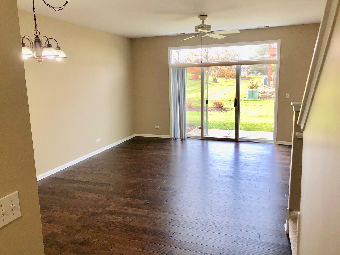 3072 Falling Waters Lane Lindenhurst, IL 60046 - Photo 4 of 27 a view of an empty room with wooden floor and a window