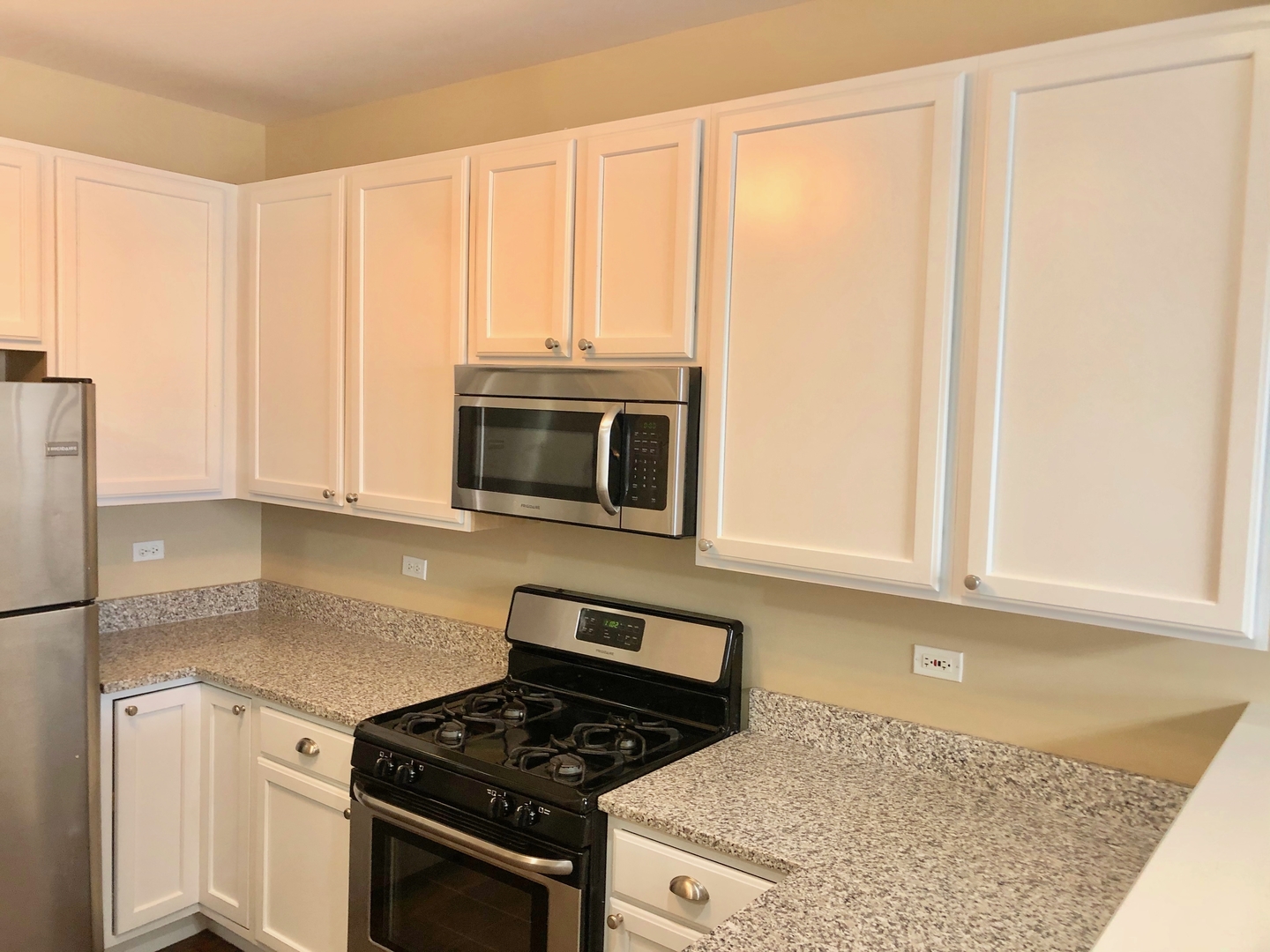 3072 Falling Waters Lane Lindenhurst, IL 60046 - Photo 6 of 27 a kitchen with granite countertop cabinets stainless steel appliances and a sink