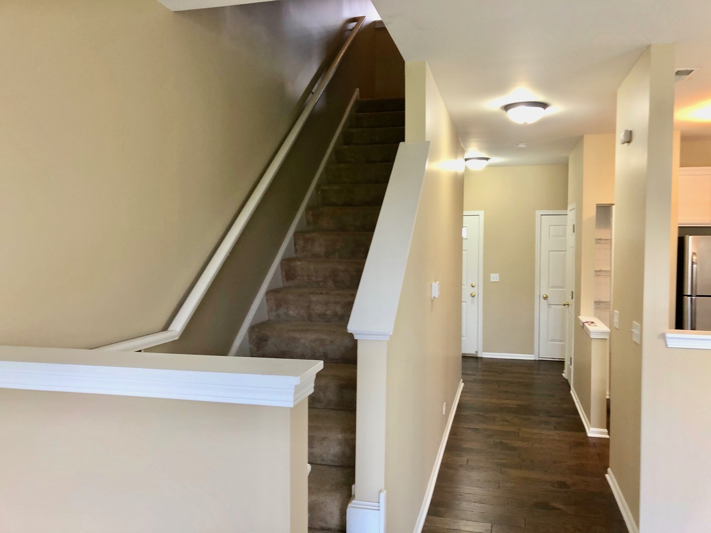 3072 Falling Waters Lane Lindenhurst, IL 60046 - Photo 9 of 27 a view of a hallway with wooden floor and staircase