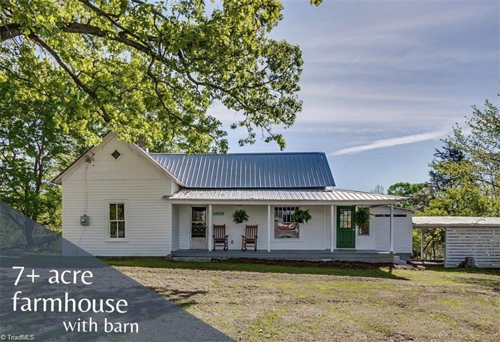 7+ acres with updated farm house and barn