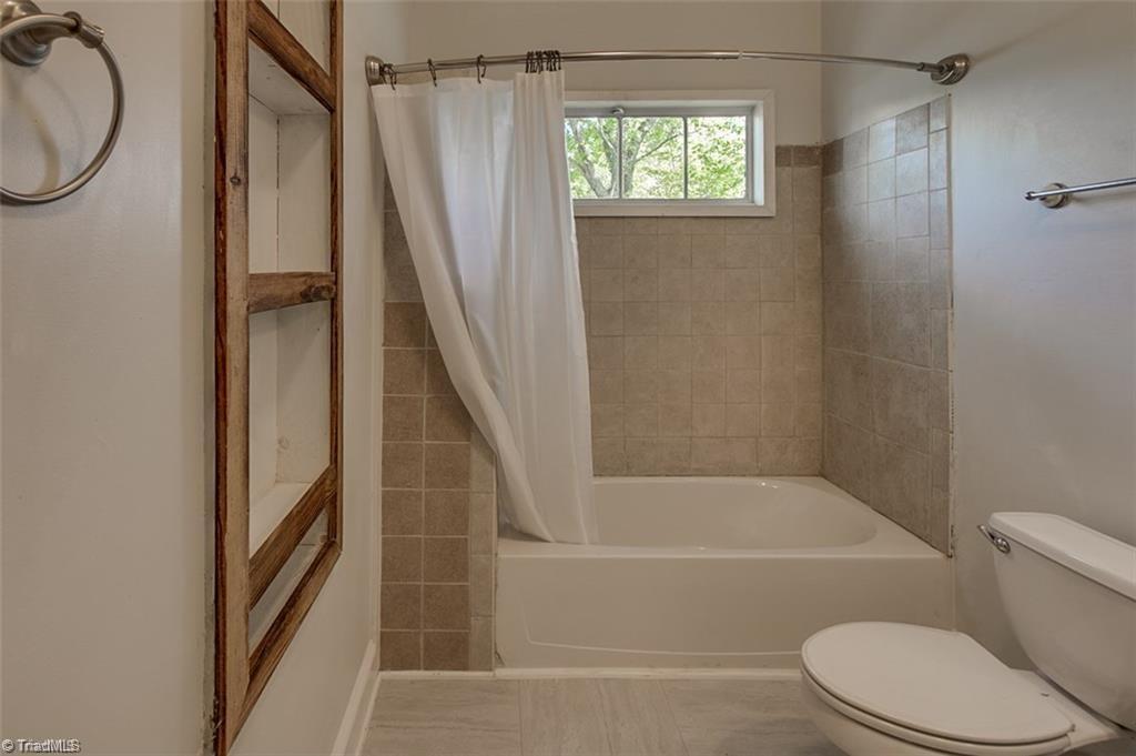 1423 Pleasant Ridge Road Ramseur, NC 27316 - Photo 17 of 30 Main bathroom with built-in shelving