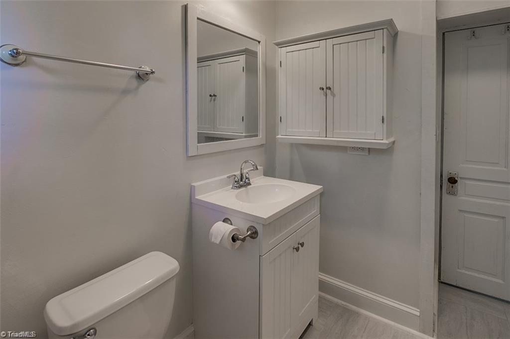 1423 Pleasant Ridge Road Ramseur, NC 27316 - Photo 18 of 30 Main bathroom. Updated fixtures and sink.