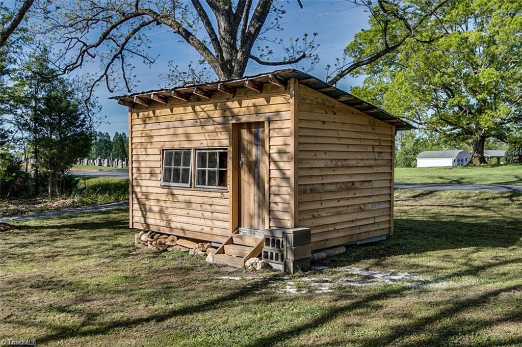 1423 Pleasant Ridge Road Ramseur, NC 27316 - Photo 22 of 30 Original shed with new exterior wood