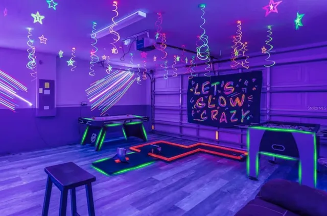 a view of a room with lots of wooden furniture