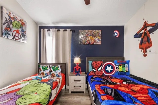 kids room with toys and wall painting
