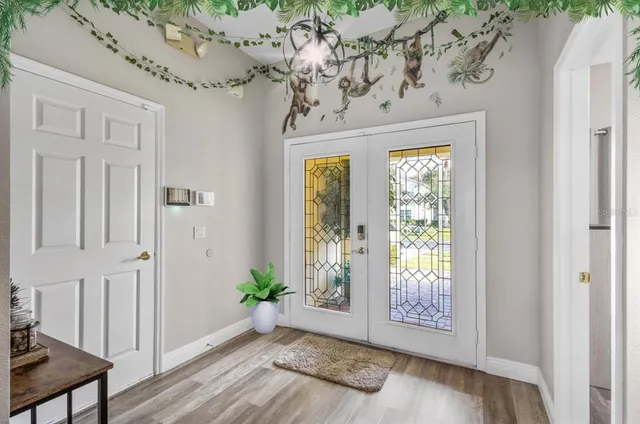 a view of entryway with wooden floor