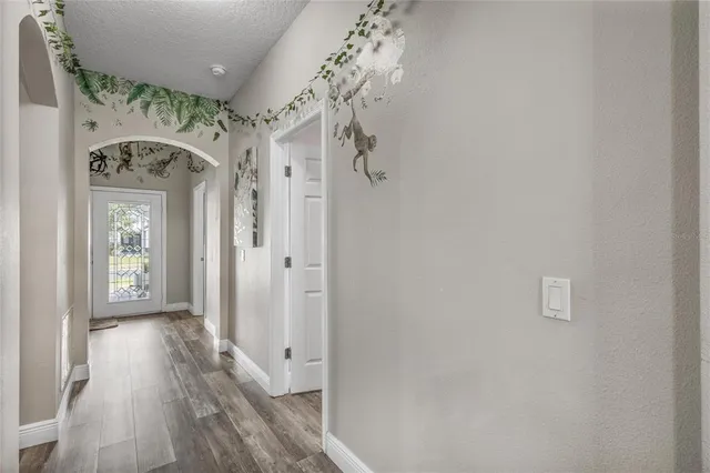 a view of entryway with wooden floor