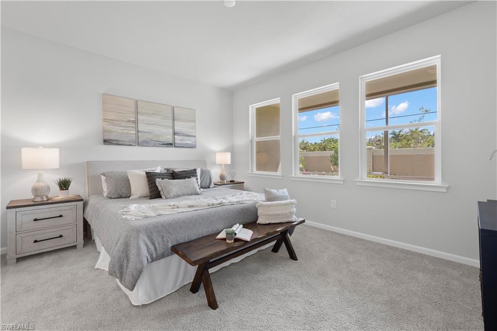 4676 Arboretum Circle, Unit 102 Naples, FL 34112 - Photo 24 of 35 a bedroom with a bed and a window