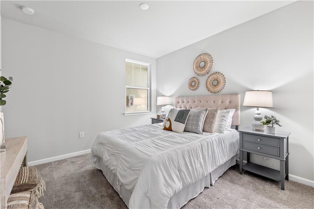 4676 Arboretum Circle, Unit 102 Naples, FL 34112 - Photo 29 of 35 a bedroom with a bed and a window