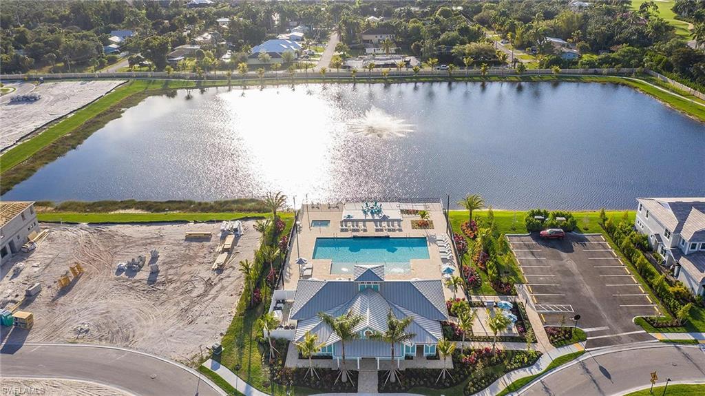 4676 Arboretum Circle, Unit 102 Naples, FL 34112 - Photo 4 of 35 an aerial view of a house with a lake view