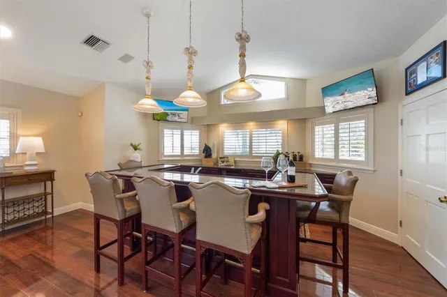 a living room with furniture and a view of kitchen