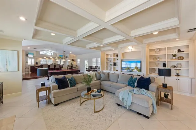 a dining room with wooden floor a chandelier