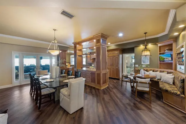 a living room with fireplace furniture and wooden floor