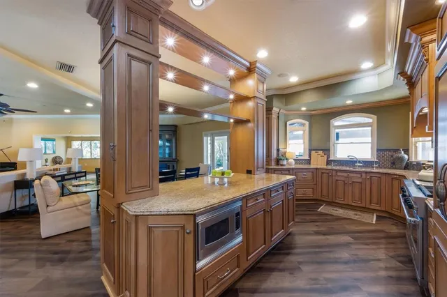 a bathroom with a double vanity sink mirror and shower