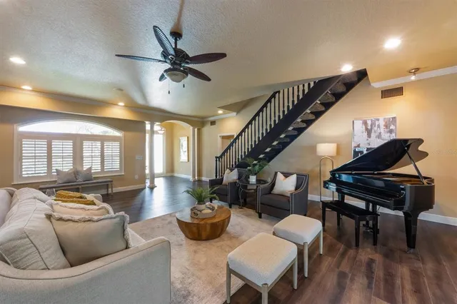 a bedroom with a bed lamps and window