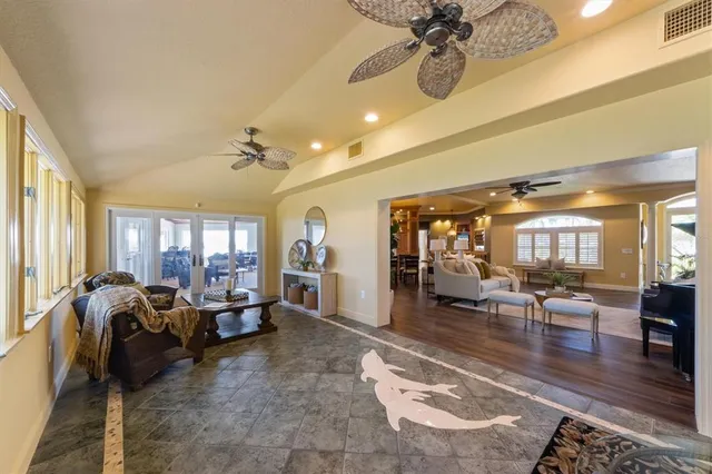 an aerial view of a house with outdoor space and a lake view