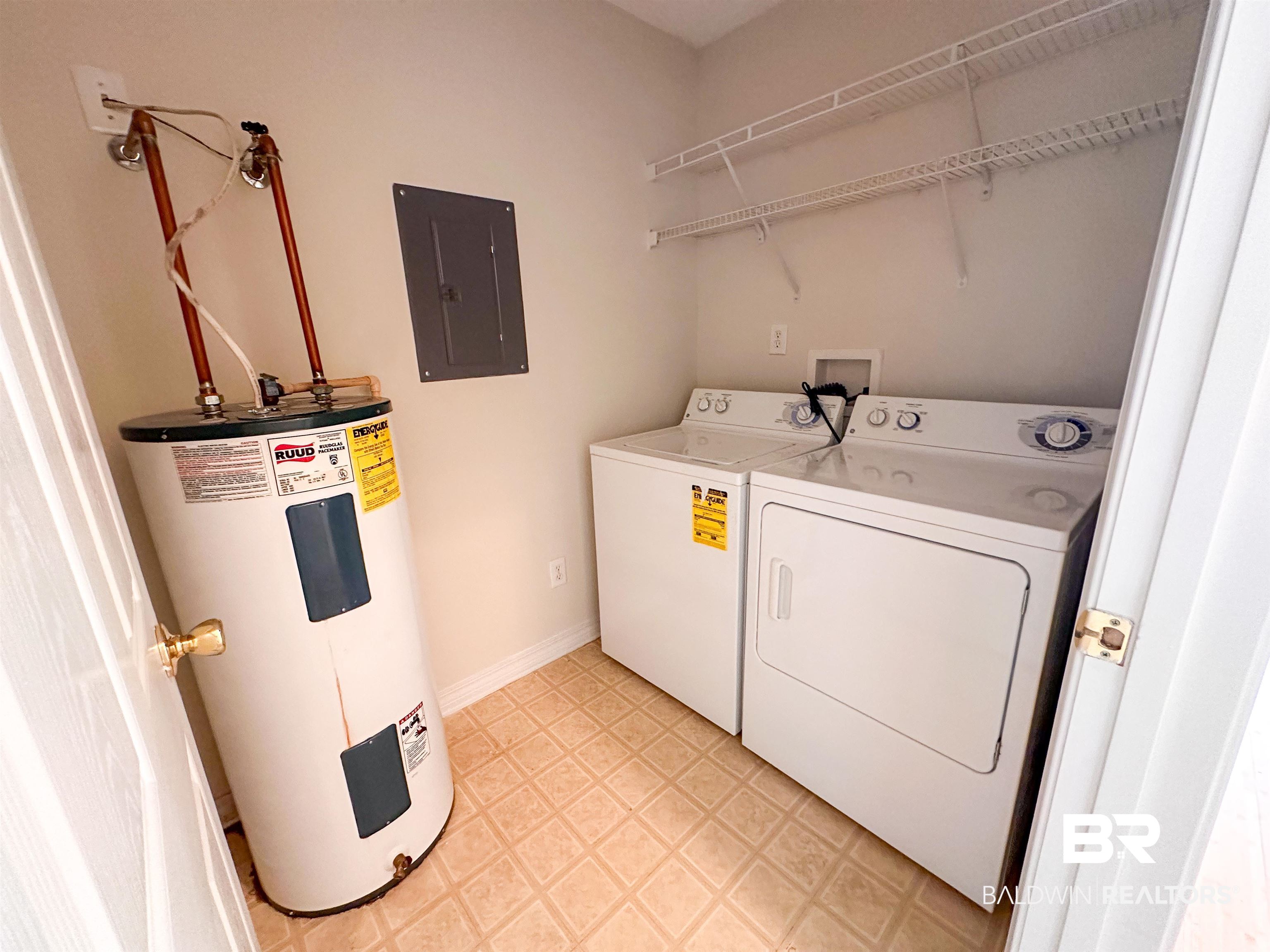 13255 Pointer Drive West Foley, AL 36535 - Photo 25 of 25 Clothes washing area featuring electric panel, washer and dryer, light tile patterned floors, and water heater