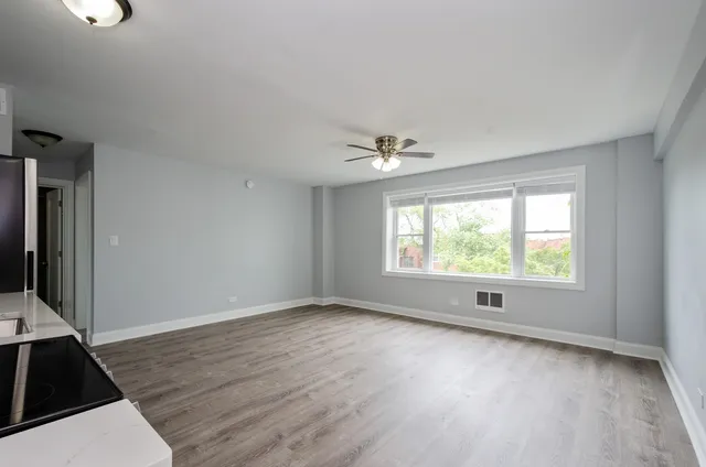 a view of an empty room with a window