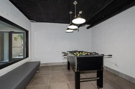 a view of a kitchen with a sink washer and dryer