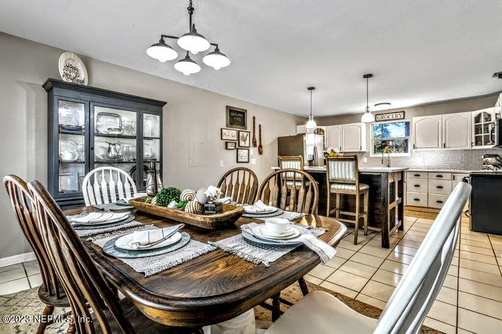 4233 Oak Lane St. Augustine, FL 32086 - Photo 2 of 40 a view of a dining room with furniture
