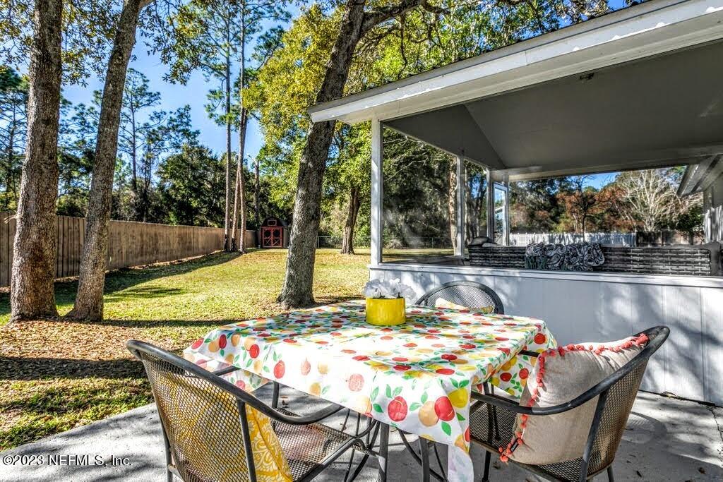 4233 Oak Lane St. Augustine, FL 32086 - Photo 32 of 40 a view of swimming pool with chairs and couch