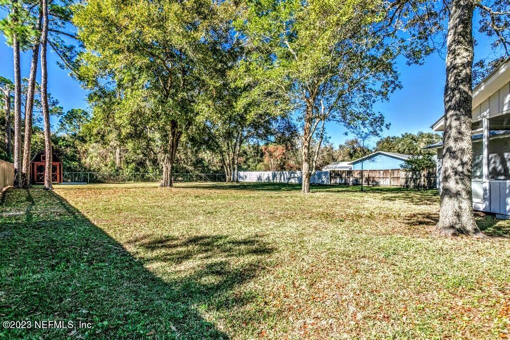 4233 Oak Lane St. Augustine, FL 32086 - Photo 36 of 40 a view of swimming pool with an outdoor seating