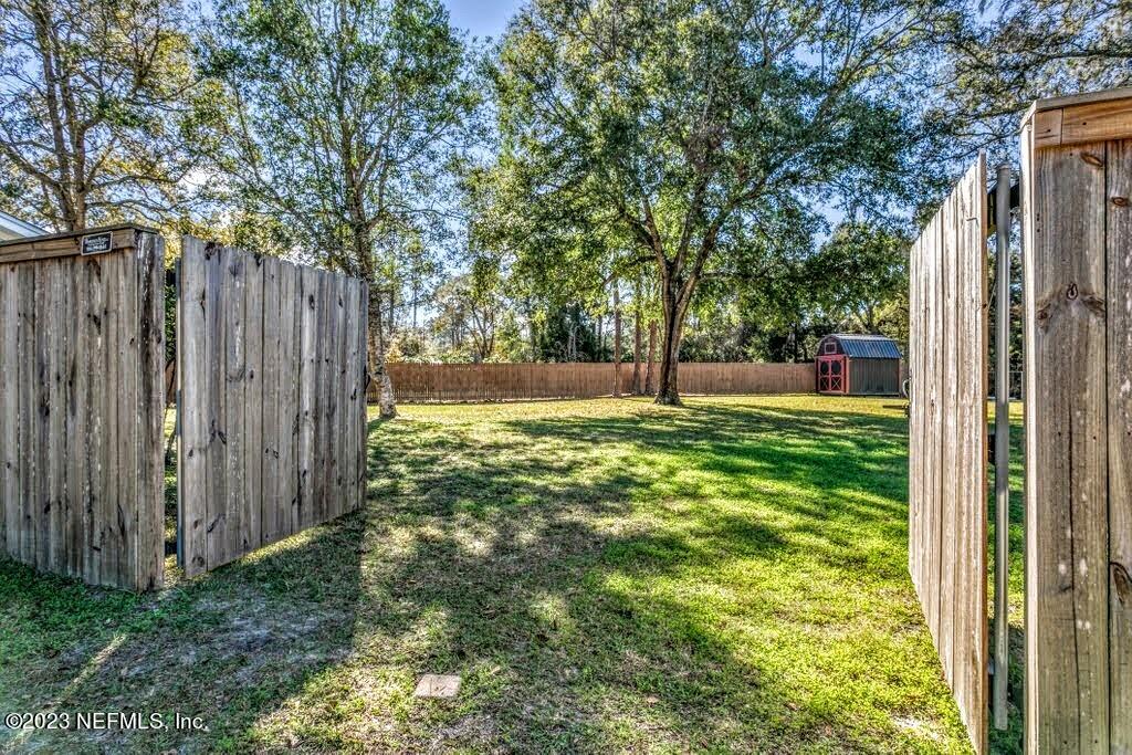 4233 Oak Lane St. Augustine, FL 32086 - Photo 39 of 40 a view of a yard with a trees