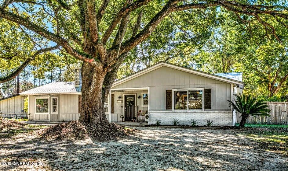4233 Oak Lane St. Augustine, FL 32086 - Photo 5 of 40 a house with trees in the background