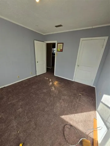 a view of a livingroom with a ceiling fan and window