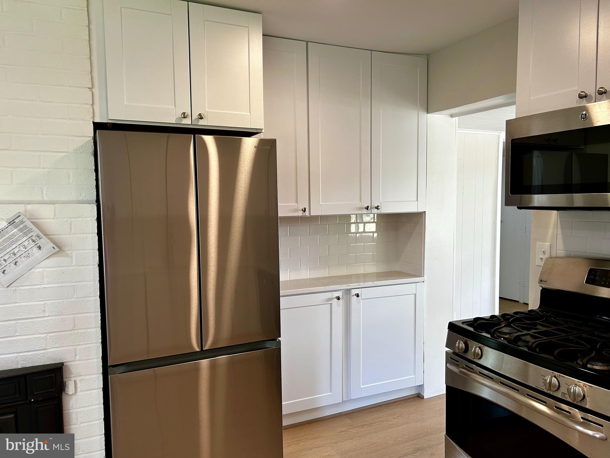 7211 Halifax Place Springfield, VA 22150 - Photo 13 of 31 New cabinets and fridge.