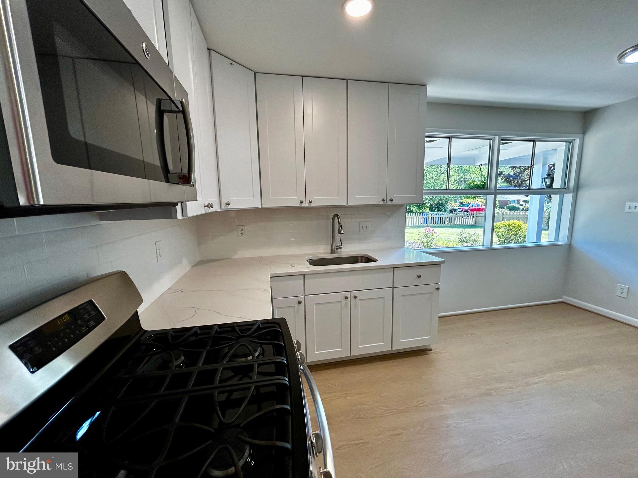 7211 Halifax Place Springfield, VA 22150 - Photo 14 of 31 LVP in kitchen, FR, LR