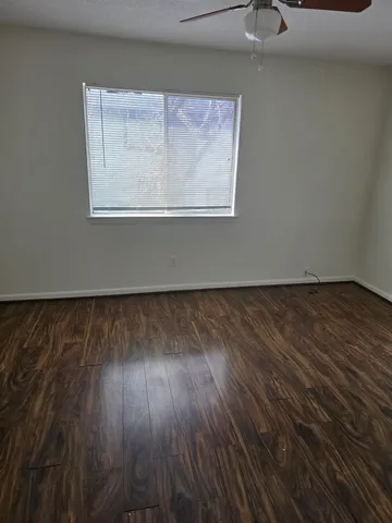 a view of wooden floor cabinets and outdoor space in back