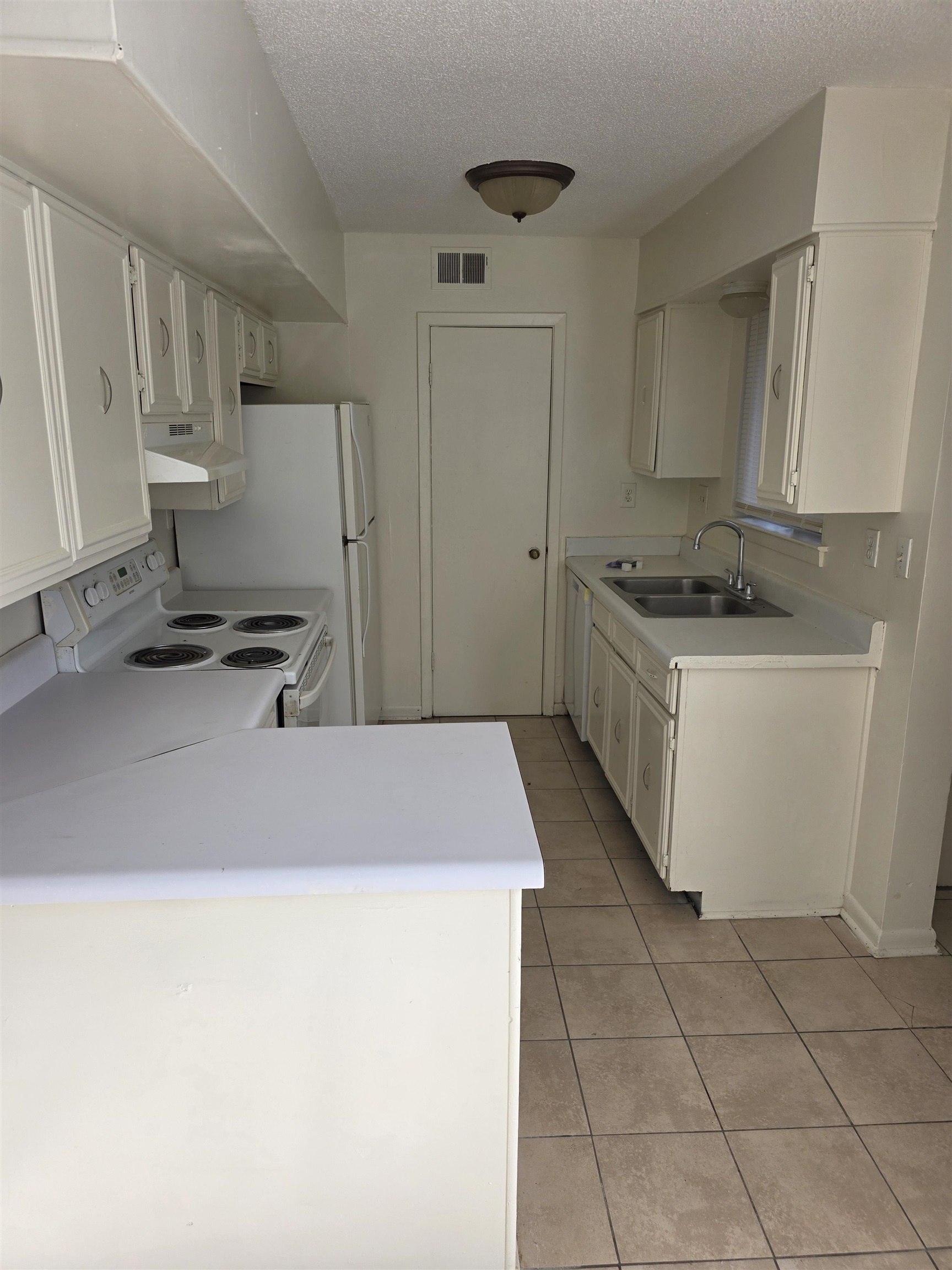 4729 Wild Plum Court, Unit 112 Memphis, TN 38118 - Photo 8 of 9 a kitchen with stainless steel appliances granite countertop a sink stove and cabinets