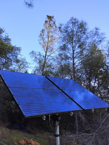 a view of a wooden deck with a table and chairs