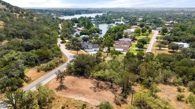 an aerial view of residential house with green space