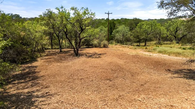 a view of a yard with a mountain