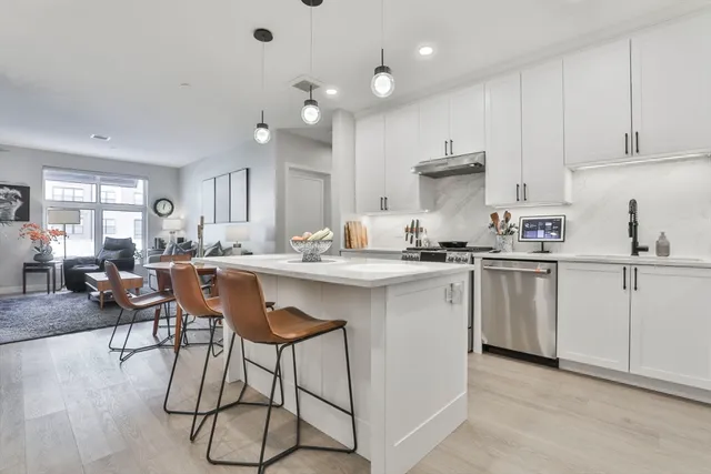 a kitchen with a sink cabinets and window