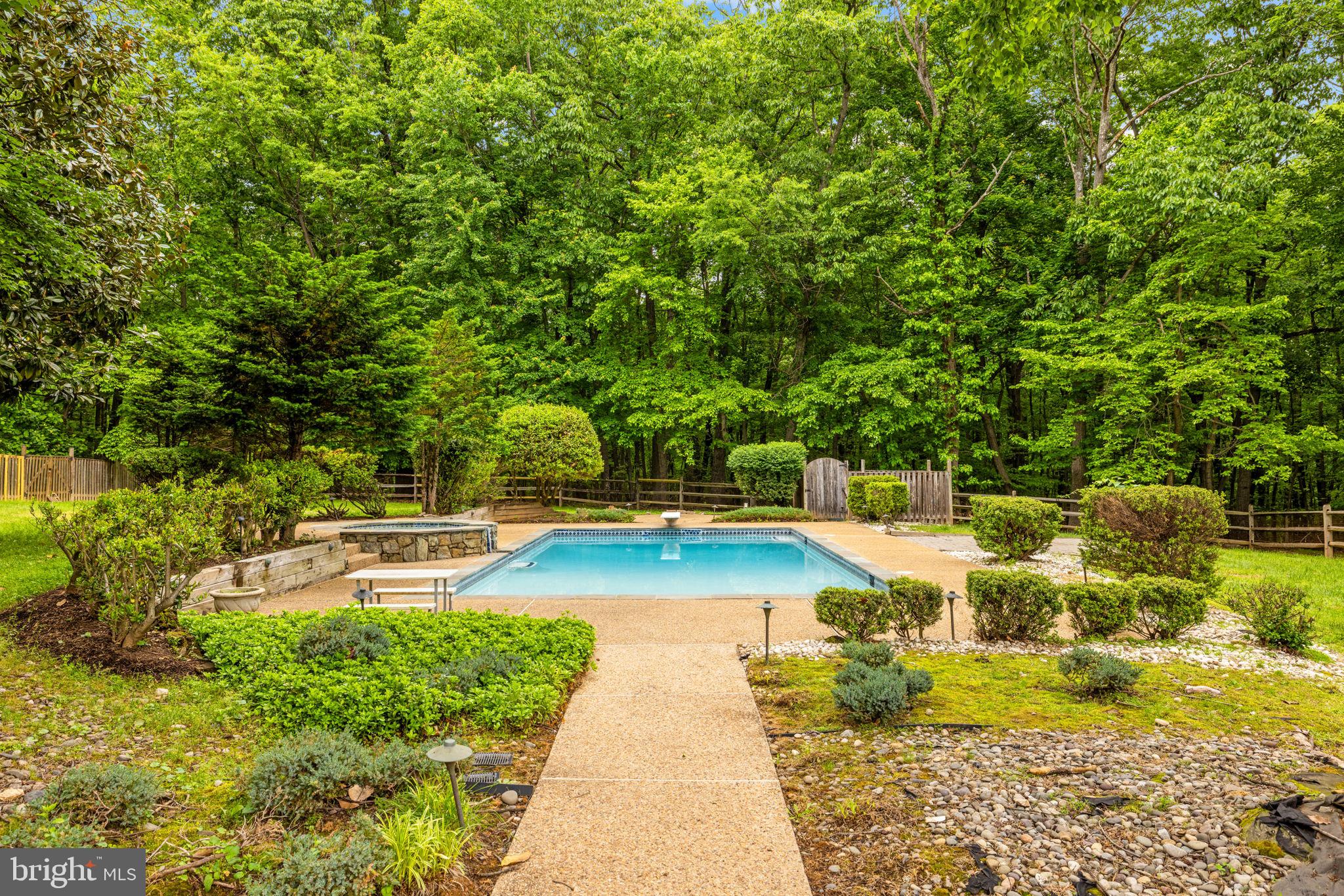 41726 Stumptown Road Leesburg, VA 20176 - Photo 53 of 91 Back Yard Pebble Stone Patio to Inground Pool/Spa