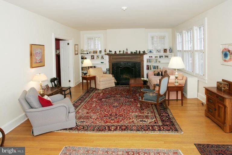 3602 Shepherd Street Chevy Chase, MD 20815 - Photo 2 of 12 a living room with furniture and a fireplace