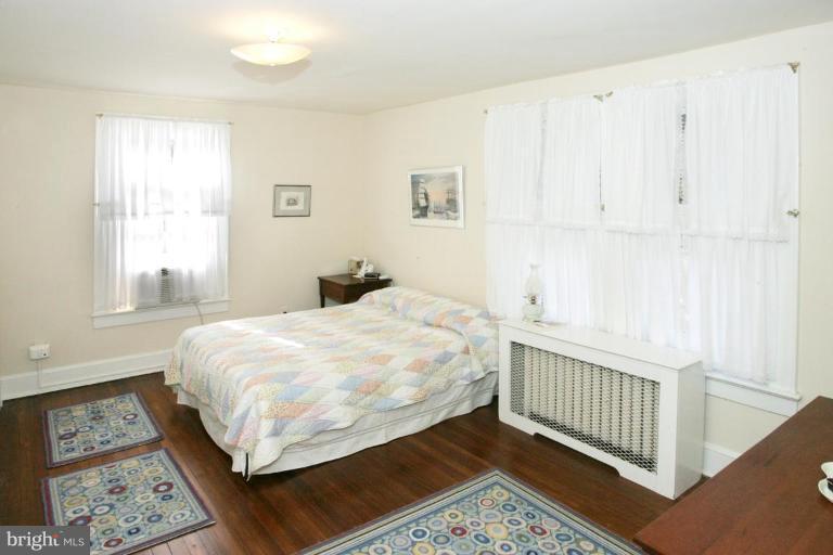 3602 Shepherd Street Chevy Chase, MD 20815 - Photo 6 of 12 a bedroom with a bed and a window
