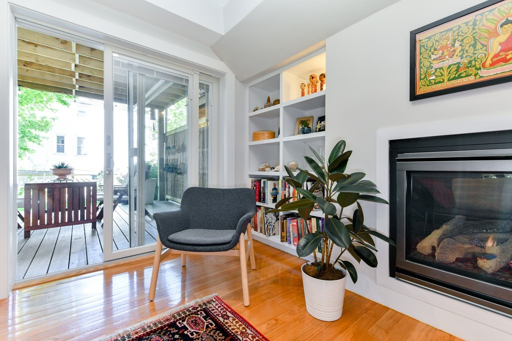 66 Wyman Street, Unit 1 Boston, MA 02130 - Photo 11 of 34 a living room with furniture a window and a potted plant